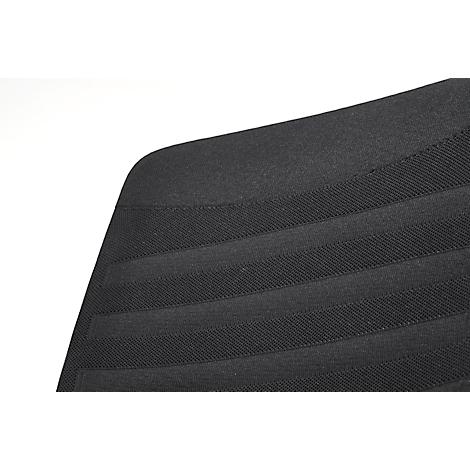 Close-up of a black padded surface with horizontal raised stripes. Rounded edge on the left, white background on the right.