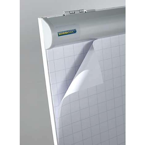 Detailed view of a flipchart with squared paper, partially turned over. The top shows a SCHÄFER SHOP logo.