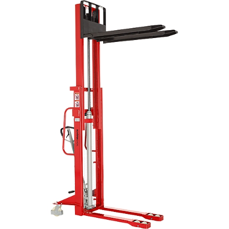Red forklift. The forklift has black forks and stands on a smooth surface.
