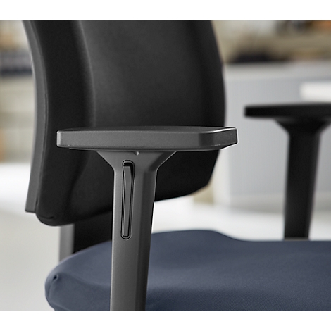 Close-up of a black office chair, focusing on the armrest and backrest.