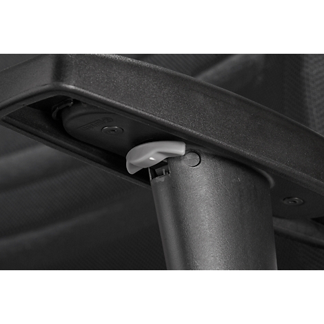 Detail shot of a grey lever on a chair with a black structure.