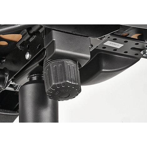 Close-up of a black office chair height adjustment. The knob and bracket are made of plastic, the frame of metal.