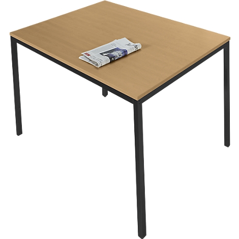 A rectangular table with light wood veneer and a black metal frame. A newspaper rests on the tabletop.