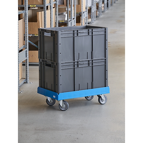 Grey transport box on blue base, with wheels, in warehouse.