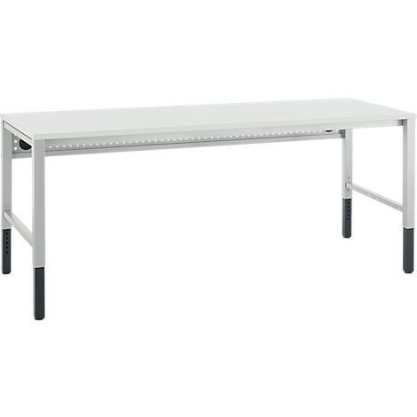 Witte, rechthoekige tafel met grijze poten en zwarte voeten. Daaronder een rij gaten.