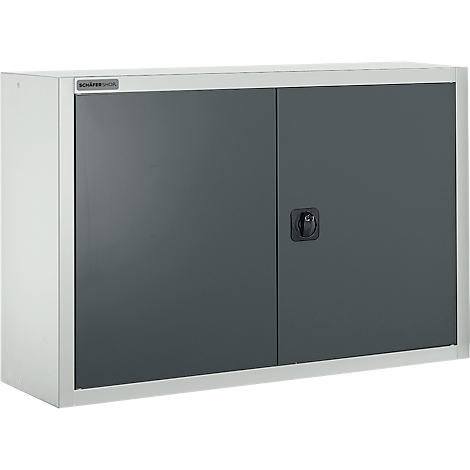 Gabinete de acero gris con dos puertas, manija negra y marco plateado, montado en una pared.