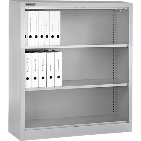 Classeur gris avec dossiers. Les étiquettes sur les dossiers sont lisibles.