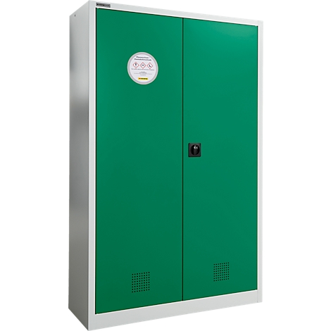 Armoire verte à double porte, cadre blanc et autocollant pour matières dangereuses.
