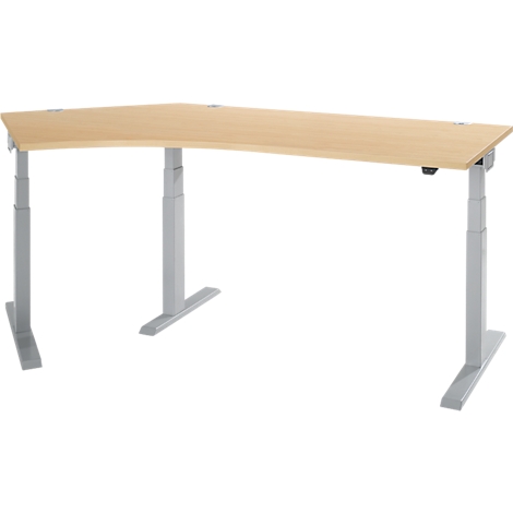 Bureau d'angle, bois clair, pieds gris. Le plateau de table a un coin arrondi.