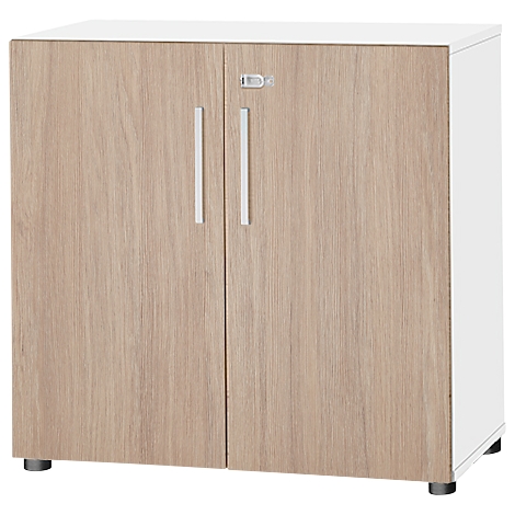 Cabinet with two doors made of wood imitation, white sides and handles. Standing on black feet.