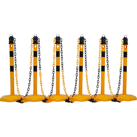 Yellow and black barrier posts with chains, lined up.