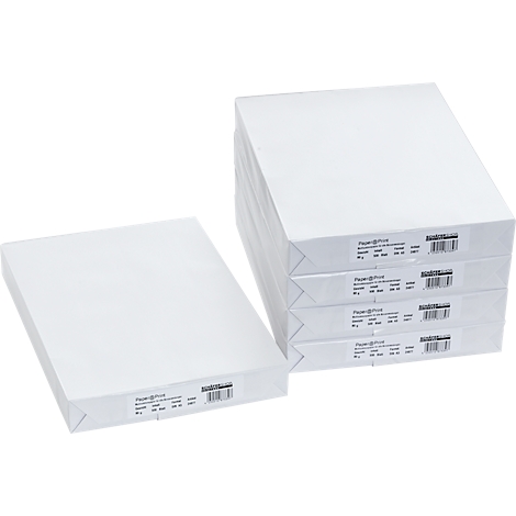 Stacks of white paper. Two stacks of paper, one on the left and a larger one on the right, stacked. Labels are visible on the paper stacks.
