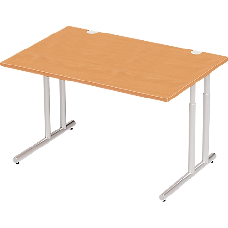 A rectangular, light brown desk with silver, height-adjustable legs.