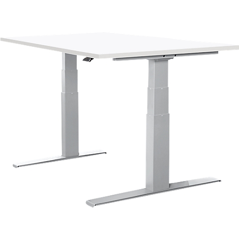A white height-adjustable desk with silver legs stands in front of a white background.