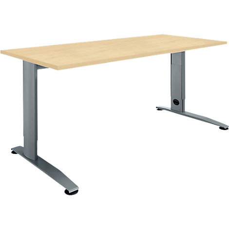 Light brown desk with metal frame. Rectangular table top, grey, height-adjustable legs.