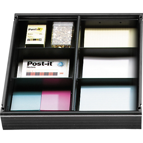Black drawer with compartments. Contains Post-it notes, notes, notepads, and a bag of small stones.