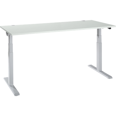 A white height-adjustable desk with gray legs stands against a white background.
