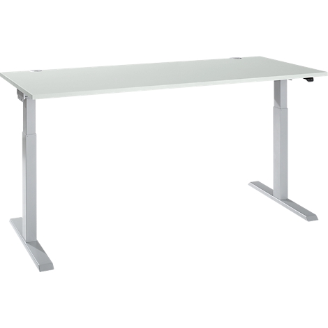 A white, height-adjustable desk with silver legs.