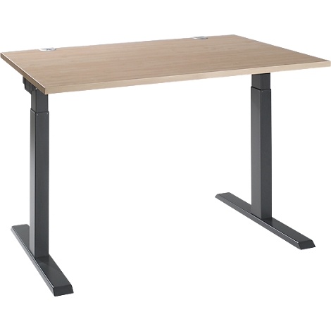 A height-adjustable desk with a light brown tabletop and gray legs stands against a neutral background.