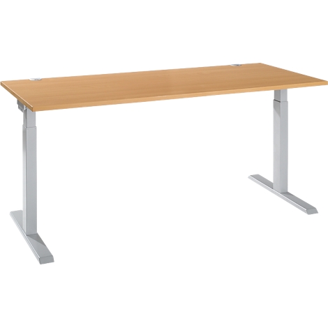 A light brown, rectangular desk with silver, height-adjustable legs on a white background.