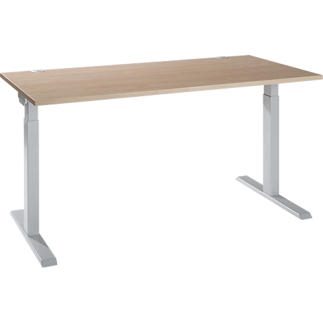 A light, height-adjustable desk against a white background. The tabletop is light brown, the legs are silver-gray.