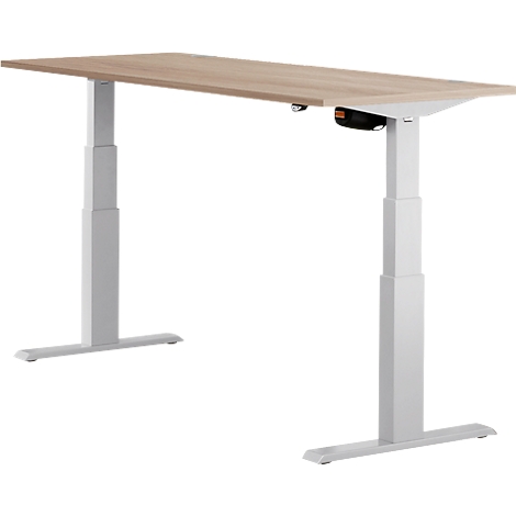 A height-adjustable desk in light wood look with white legs. A control is visible under the tabletop.
