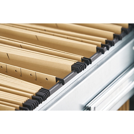 Close-up of hanging file folders in a file cabinet. The files are light brown and neatly arranged.