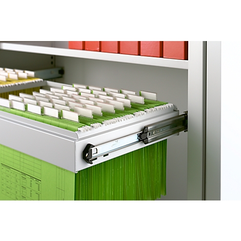 Pulled out drawer with hanging files; green files, white tabs.