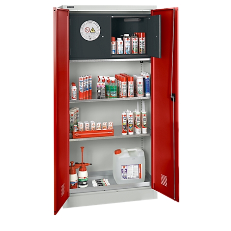 Open red steel cabinet with various chemicals and hazard symbols.