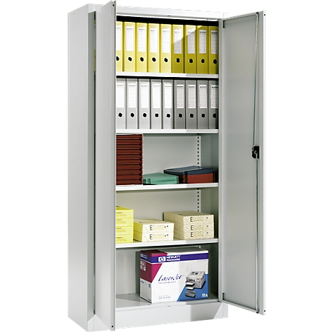 An open, gray filing cabinet with files and office supplies. The door is open, revealing yellow and white binders.