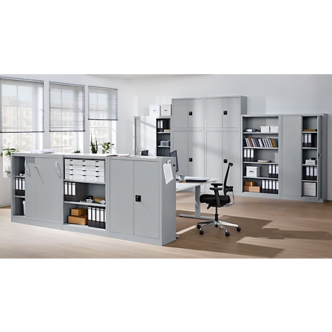 An office with grey cabinets, desk, chair and files.