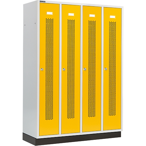 Yellow lockers with white frames. Four doors with a perforated pattern. The cabinets are provided with white rectangles at the top and bottom.