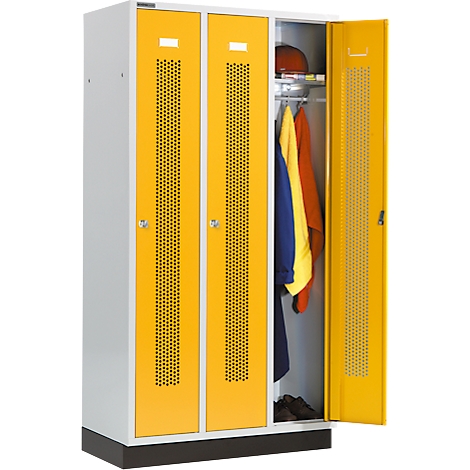 Yellow locker with open door. Inside, clothes are hanging and shoes are standing on the floor.