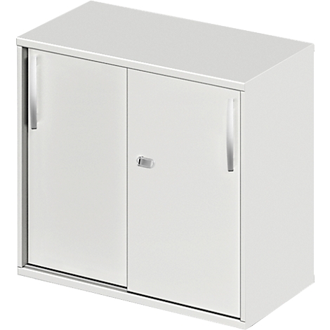 A white wall cabinet with two doors. The handles are silver, a key is in the middle.