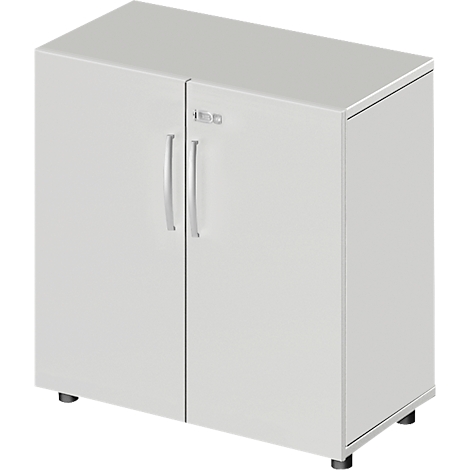 White cabinet with two doors, silver handles, and small black feet.