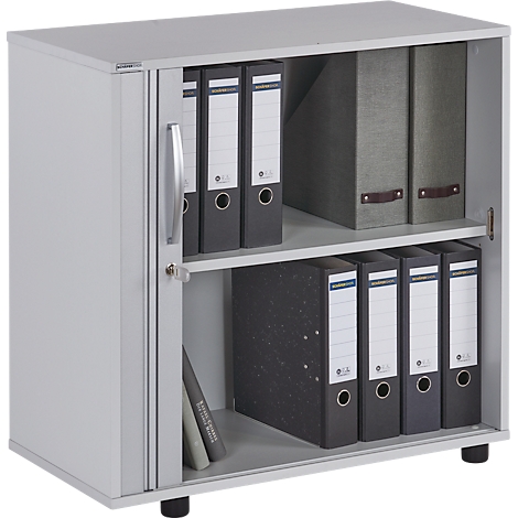Grey filing cabinet with open door. Filled with file folders and books. Small, black base.