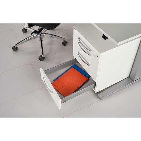 Desk with an open drawer. Inside, a red and blue folder.