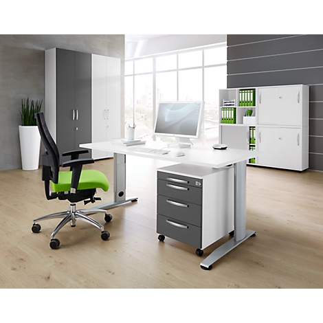 Office with modern desk, office chair with green seat, and white cabinets.