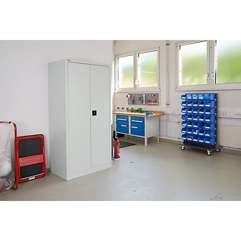 Workshop with workbench, cabinet, drawer system, and windows. Bright colors.