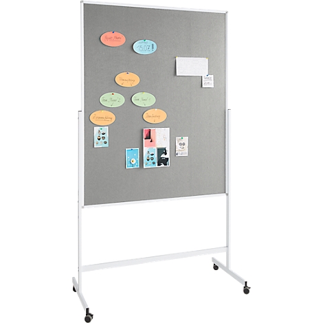 Grey pinboard on white frame, with colorful notes and sticky notes. On wheels.