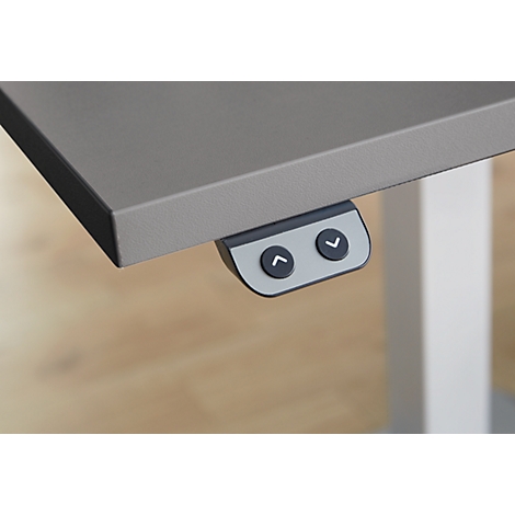 Gray desk with height adjustment controls. Two buttons with arrows.