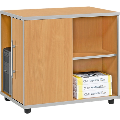 A light wood computer table with a compartment for the computer, a shelf, and stacks of paper.