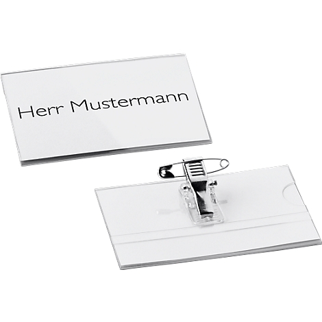 Two name badges. One with the inscription 'Herr Mustermann'. The second with a safety pin.
