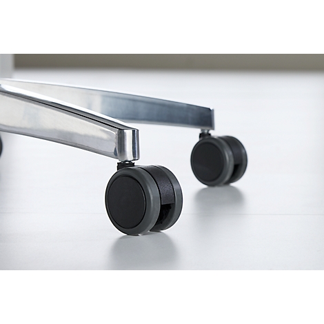 Close-up of an office chair: Detail view of the black casters and the silver frame on a light background.