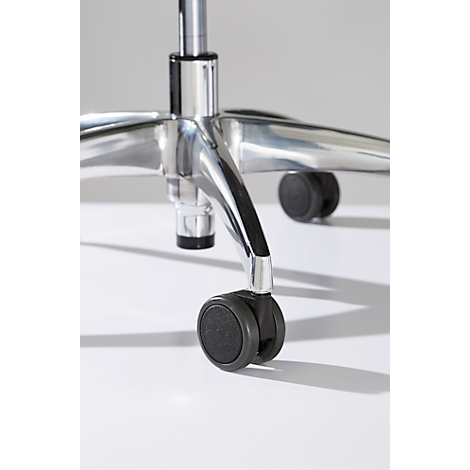 Close-up of the wheels and foot of an office chair, made of chrome-plated metal and black wheels. The image has a white background.