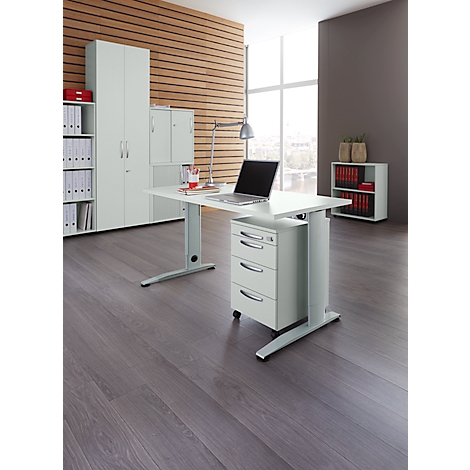 Office with desk, laptop, cabinets and shelves.