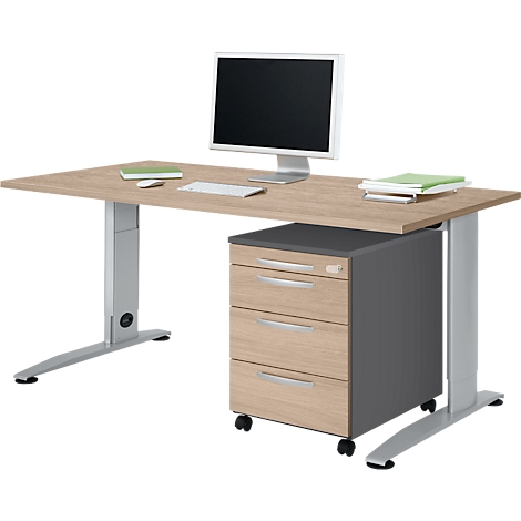 Height-adjustable desk with monitor, keyboard, and rolling container. The wood of the tabletop has a natural grain.