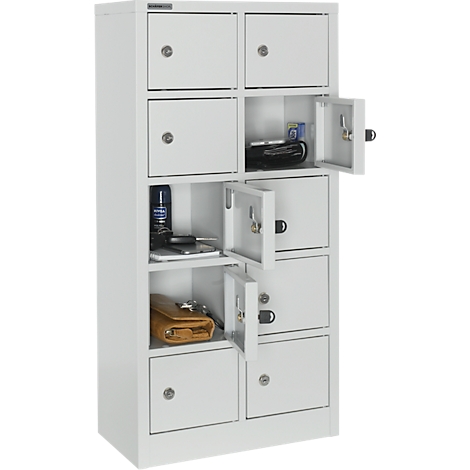 White cabinet with eight compartments, some doors open. Items like a wallet, mobile phone and headphones are in the compartments.