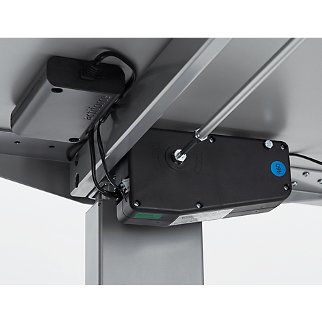 Nahaufnahme eines mechanischen Teils unter einem Schreibtisch, Kabel, Motor, Display.