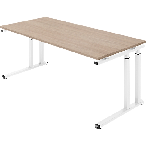 Hellbrauner Schreibtisch mit weißem Gestell, leicht von oben fotografiert.